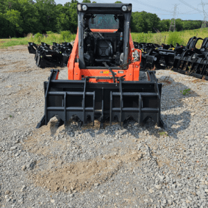 Kubota holding skid steer grapple